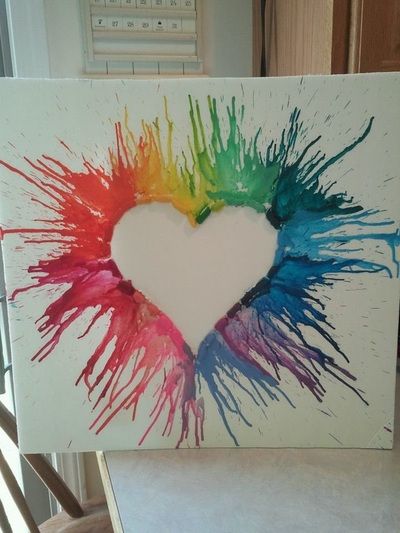 a heart made out of melted paint on a canvas