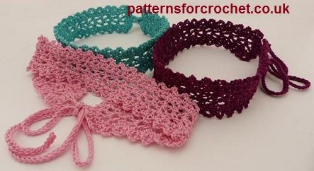 three crocheted headbands with ties on them sitting next to each other