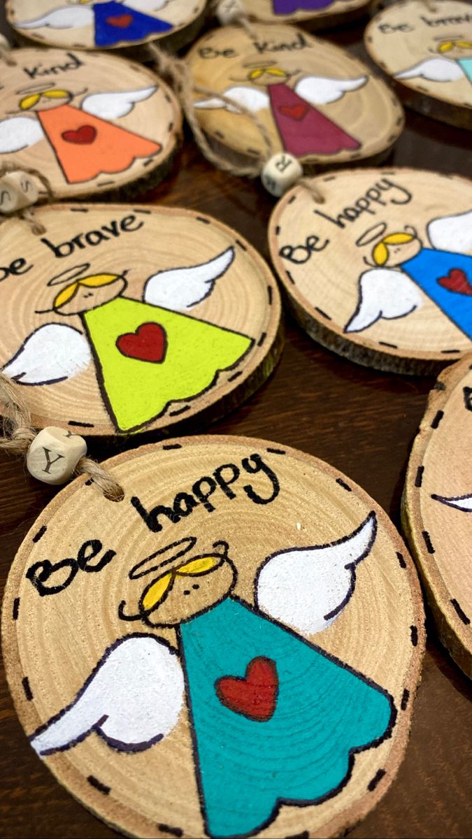 some wooden ornaments with different designs on them