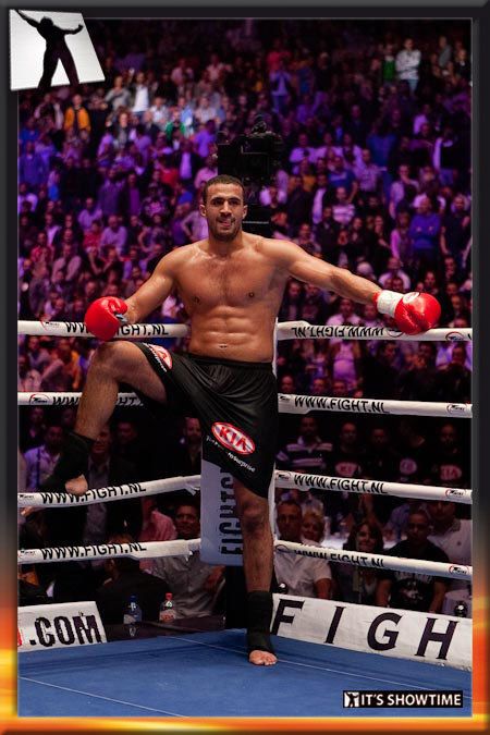 a man standing on top of a boxing ring