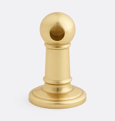 a brass colored knob with a ball on it