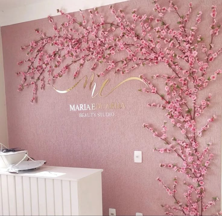 a pink wall with flowers on it