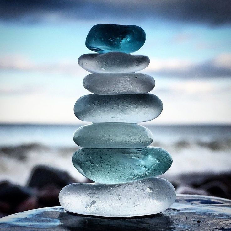 a stack of rocks sitting on top of a beach