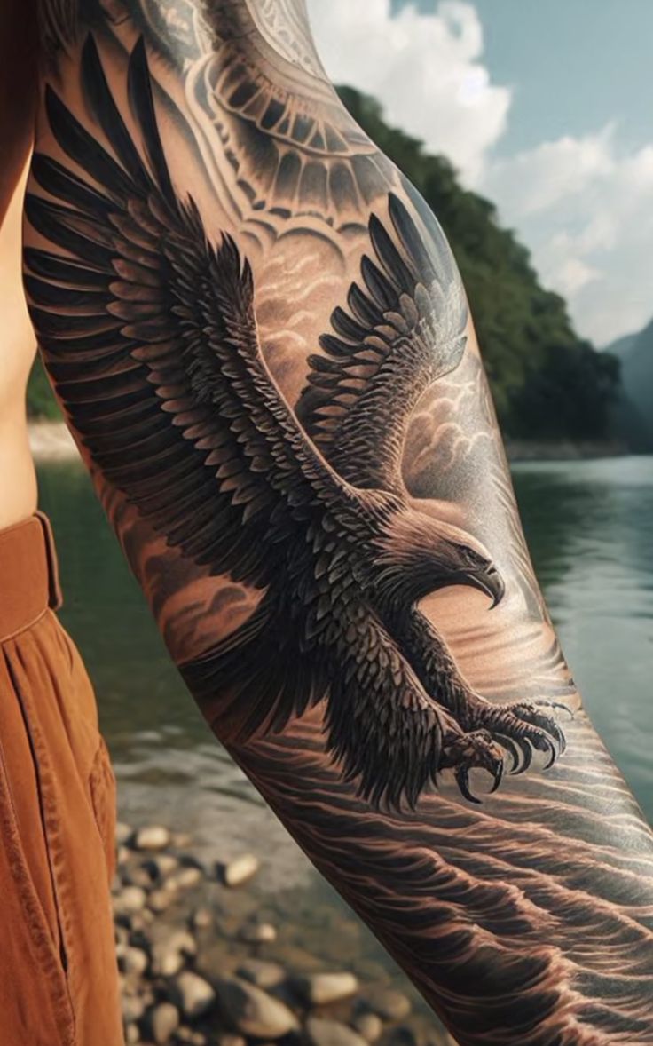 a man with an eagle tattoo on his arm is standing by the water and looking at the camera