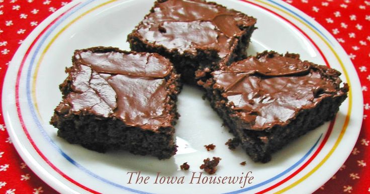 four pieces of chocolate cake on a plate