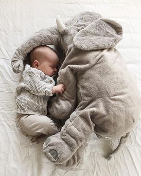 a baby is sleeping in a elephant costume