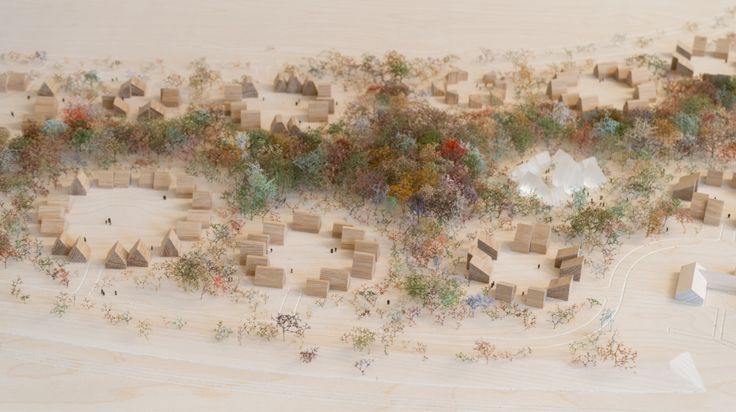 an aerial view of a city made out of wood blocks and trees on the ground