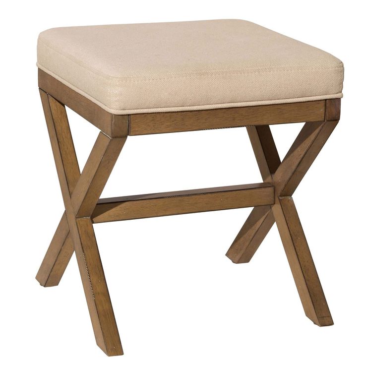 a wooden stool with a beige seat cushion