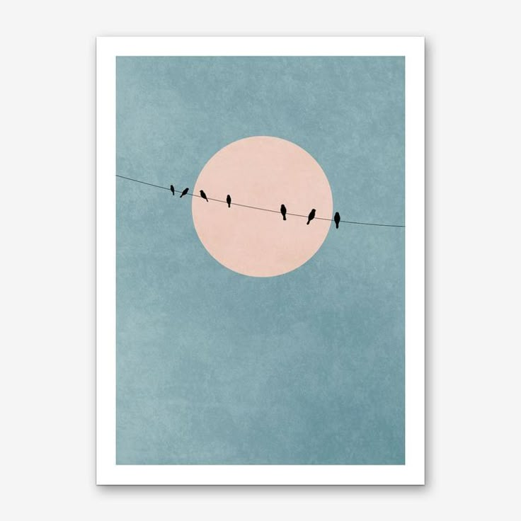 birds sitting on a wire with the moon in the background