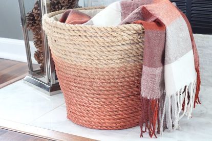 a basket with a blanket on top of it