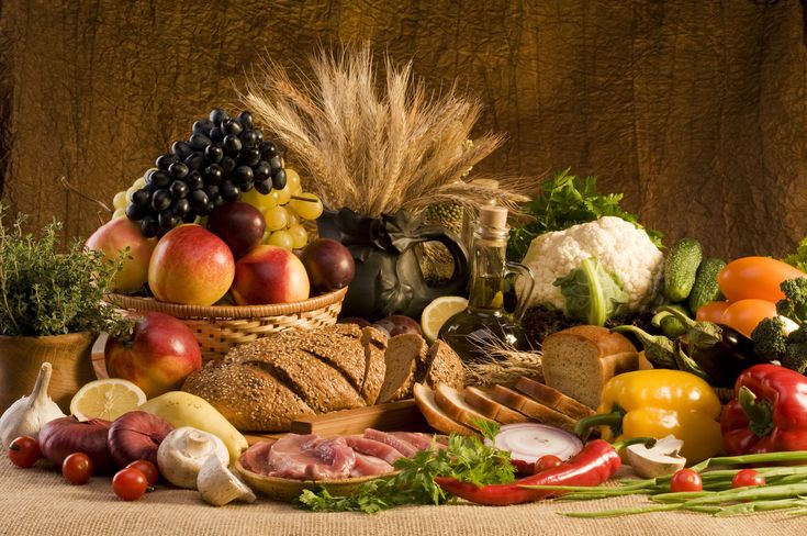 a table topped with lots of different types of fruits and vegetables