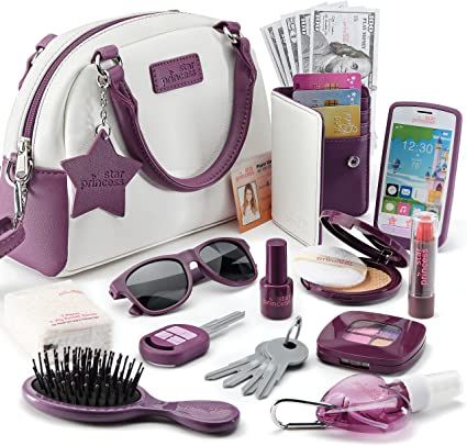 the contents of a women's purse are arranged in purple and white, including a cell phone