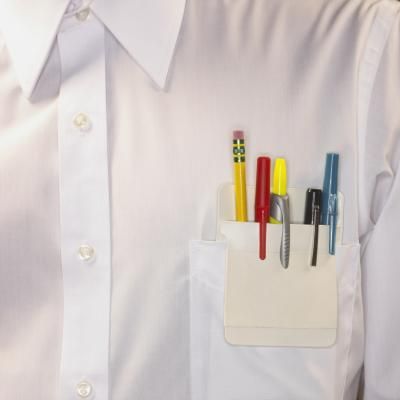 a man's white shirt with pens and pencils in his pocket