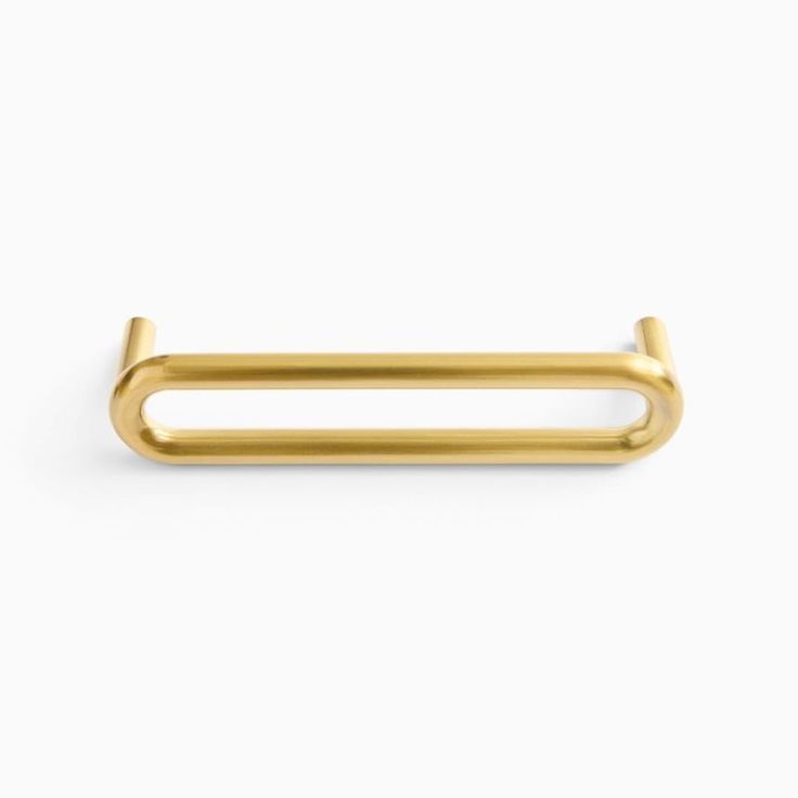 a gold metal handle on a white background