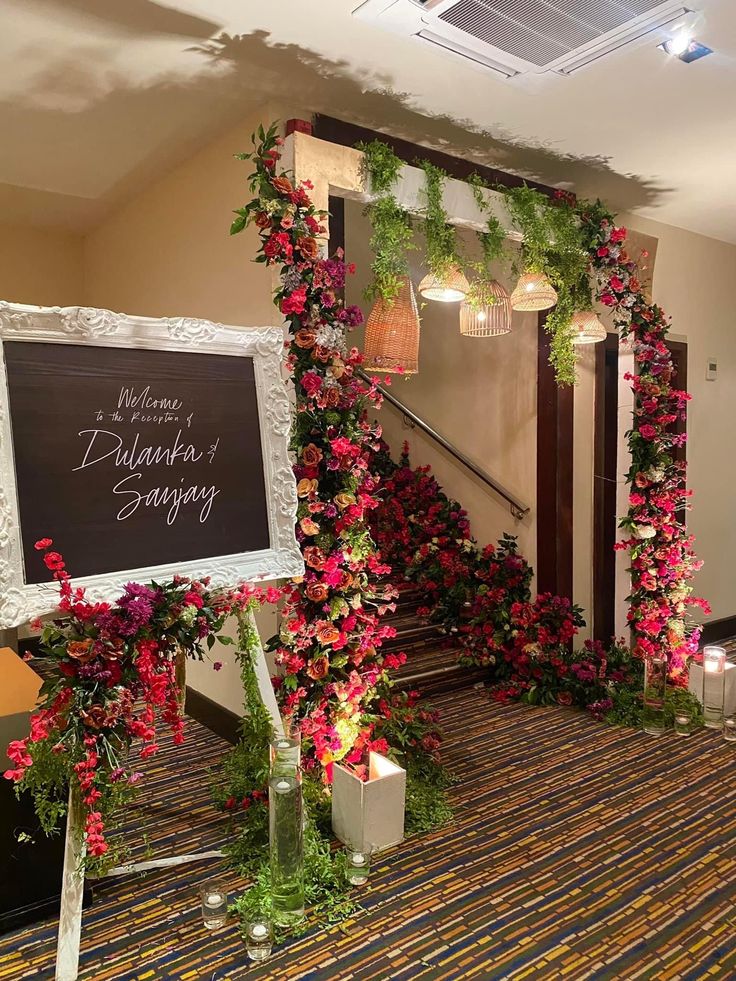 flowers and greenery decorate the entrance to an event