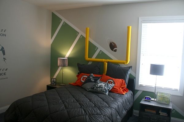 a bed room with a neatly made bed next to a window