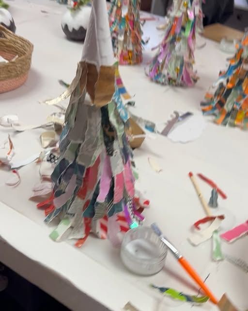 a table topped with lots of different types of crafting supplies on top of it