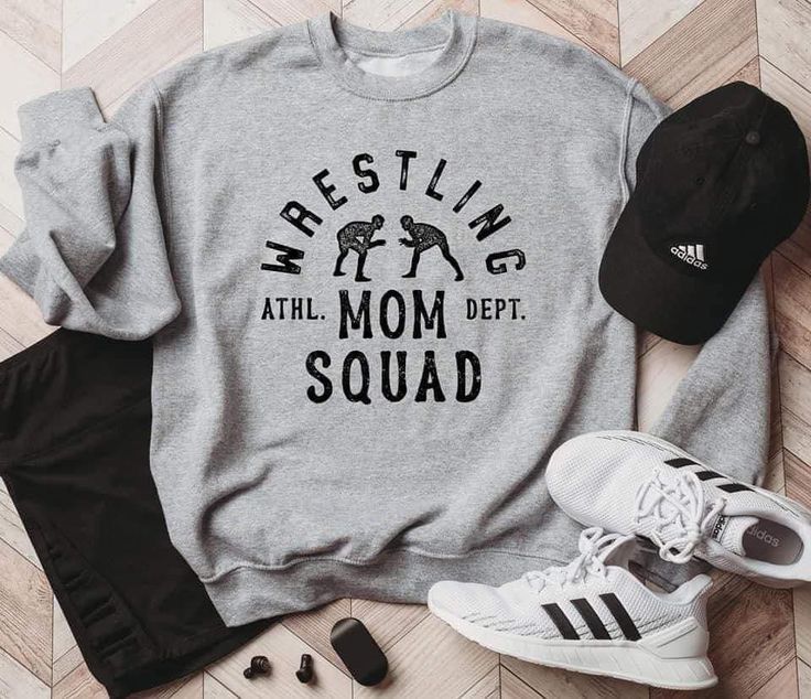 a sweatshirt that says basketball at the mom dept squad next to shoes and headphones