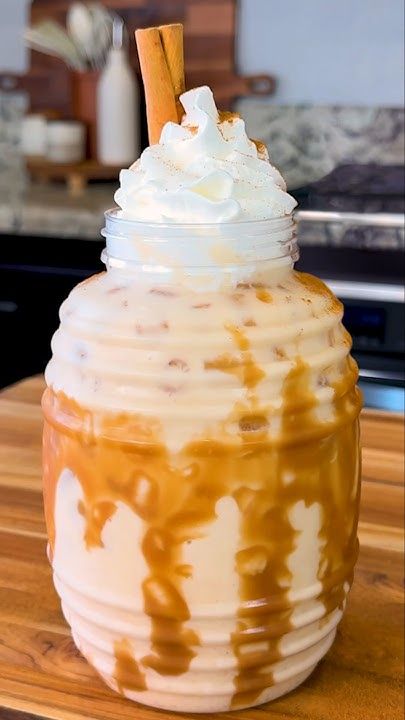 an iced drink with caramel and whipped cream