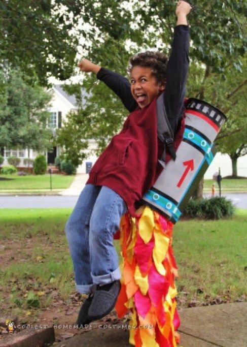 a young boy is jumping up in the air