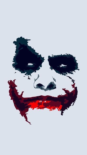 the joker's face is painted in red and black