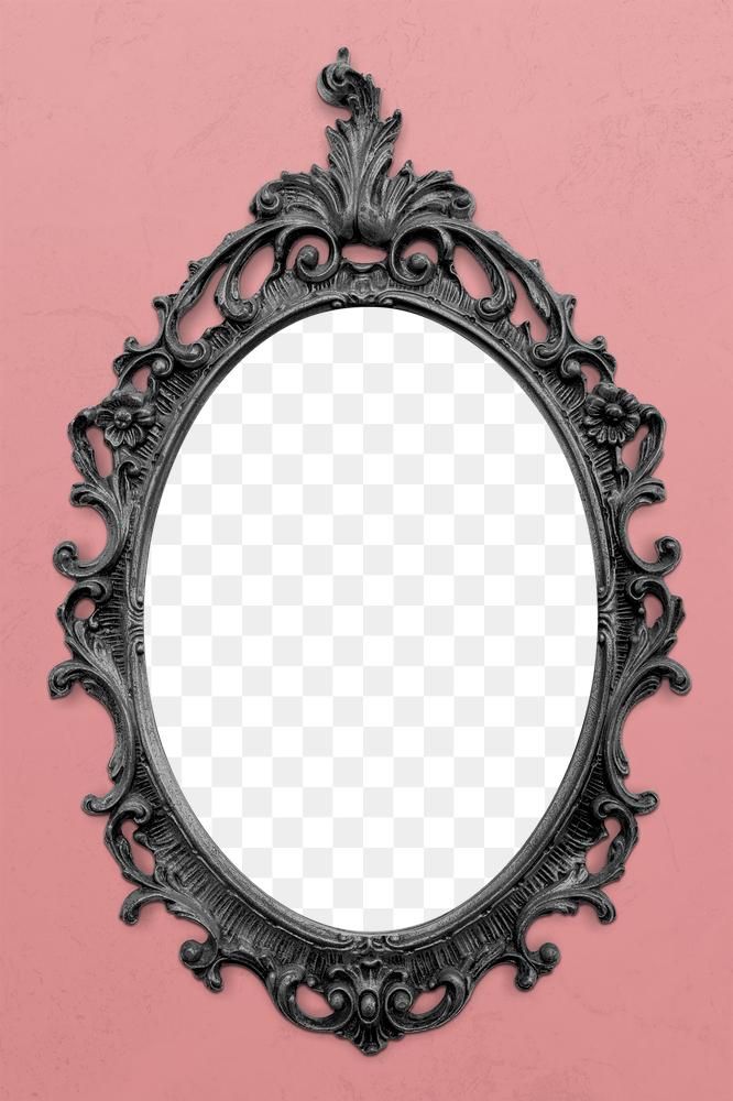 an ornate black mirror on a pink wall