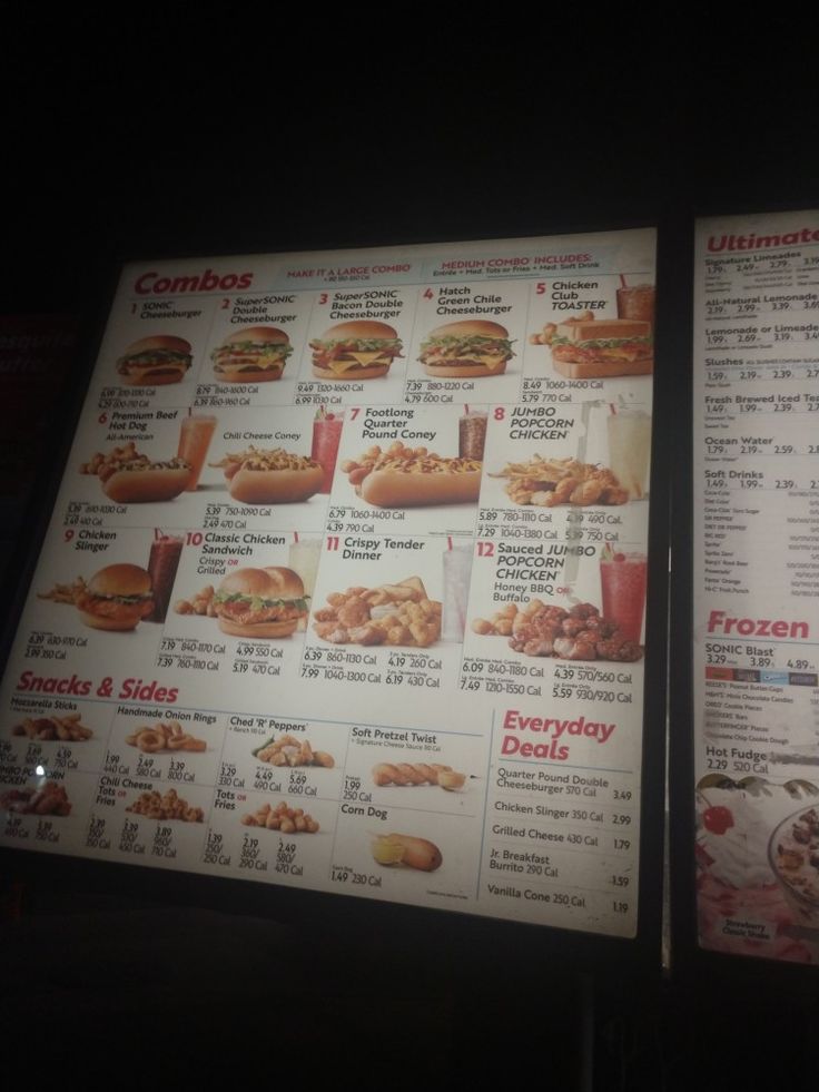 two large menus with different types of food on them in front of a dark background