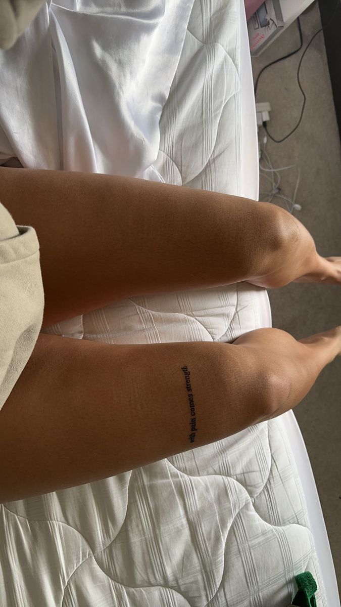 two people with tattoos on their arms and legs