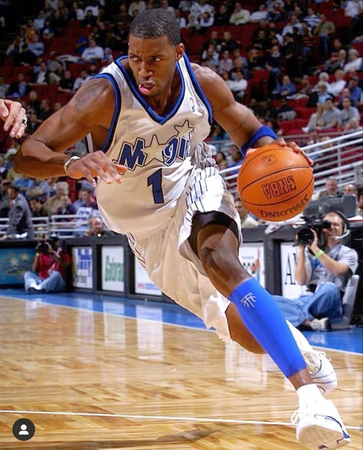 a basketball player is running with the ball