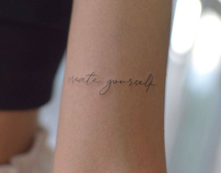 a woman with a tattoo on her arm that says, whatever you're self