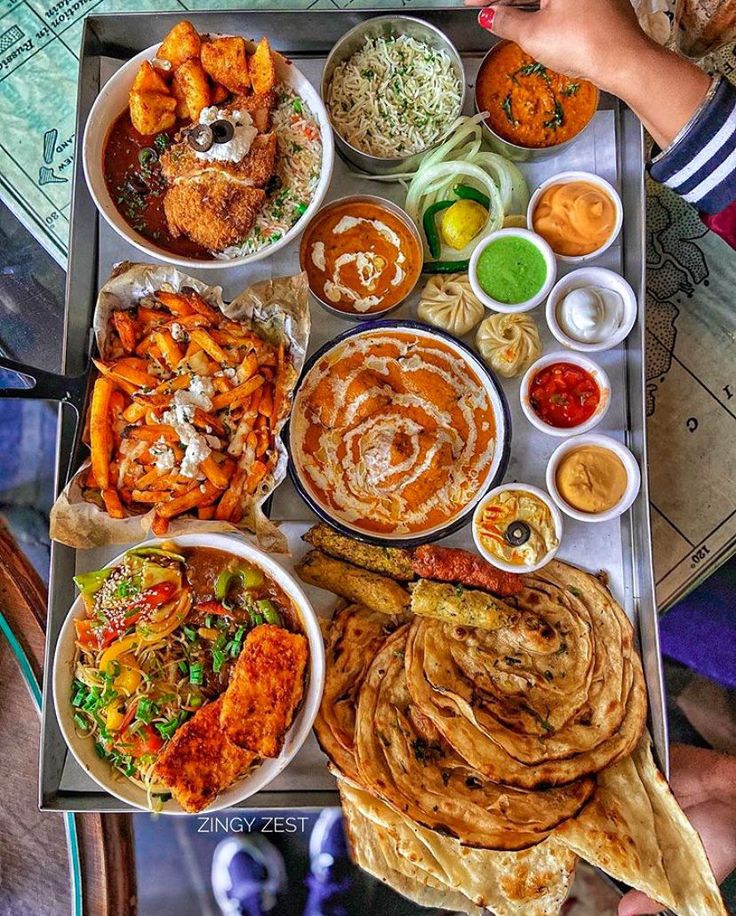 a tray filled with lots of different types of food