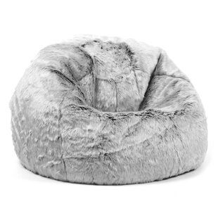 a large grey bean bag chair with fur on it's back and the seat up