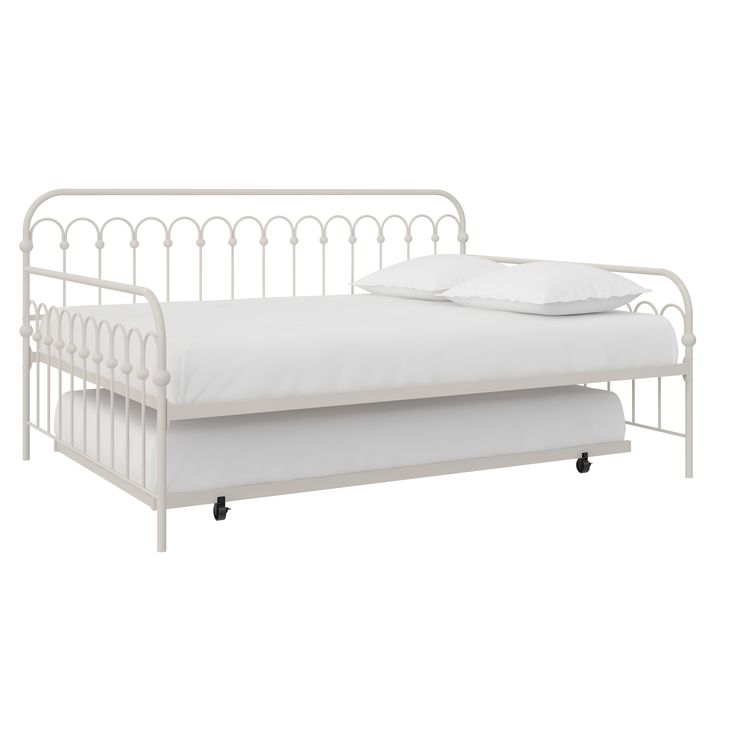 a white metal daybed with two pillows on it's sides and one bed frame