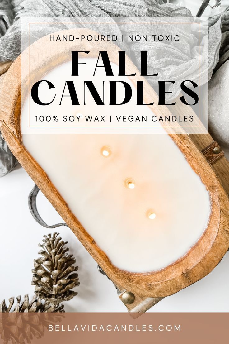 a wooden tray with candles on it and pine cones in the background text reads, hand - poured non - tonic fall candles 100 % soy wax vegan candles