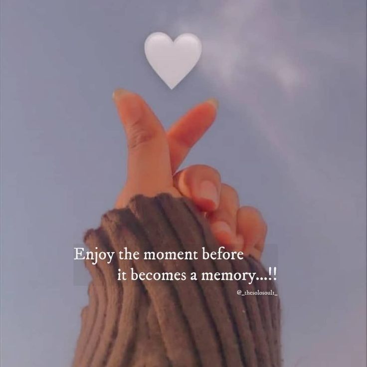 someone holding their hand up to the sky with a heart above it and an inscription below that reads, enjoy the moment before it becomes