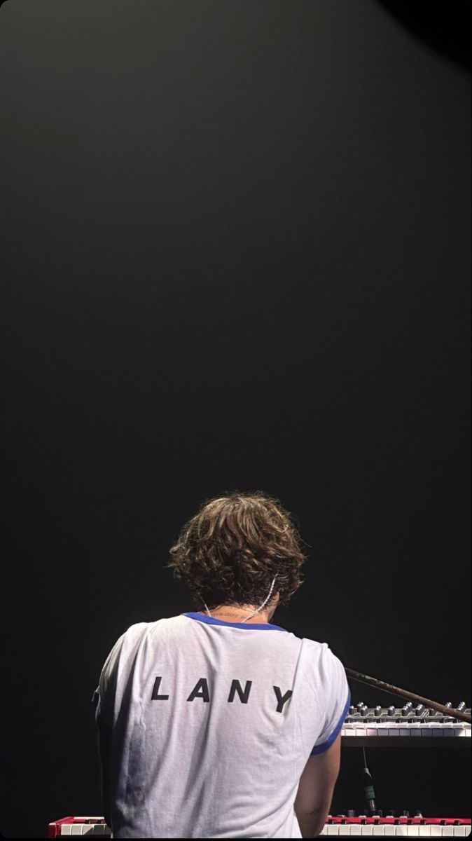 a man sitting in front of a keyboard