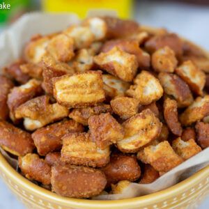 a yellow bowl filled with nuts on top of a table