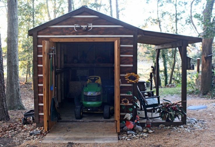 a small shed with a lawn mower in it