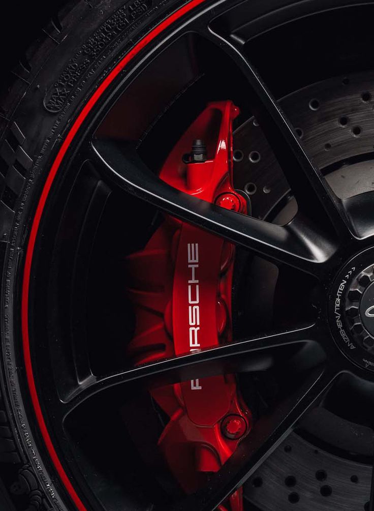 the front wheel of a red sports car