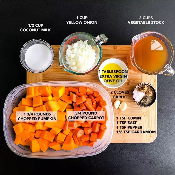 the ingredients to make this dish include carrots, onions, and other vegetables on a cutting board