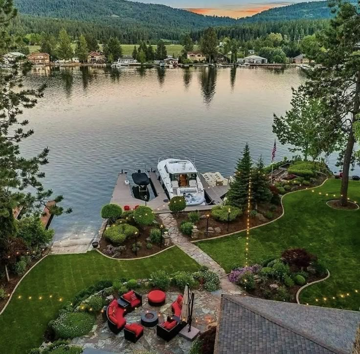 an aerial view of a boat dock in the middle of a lake