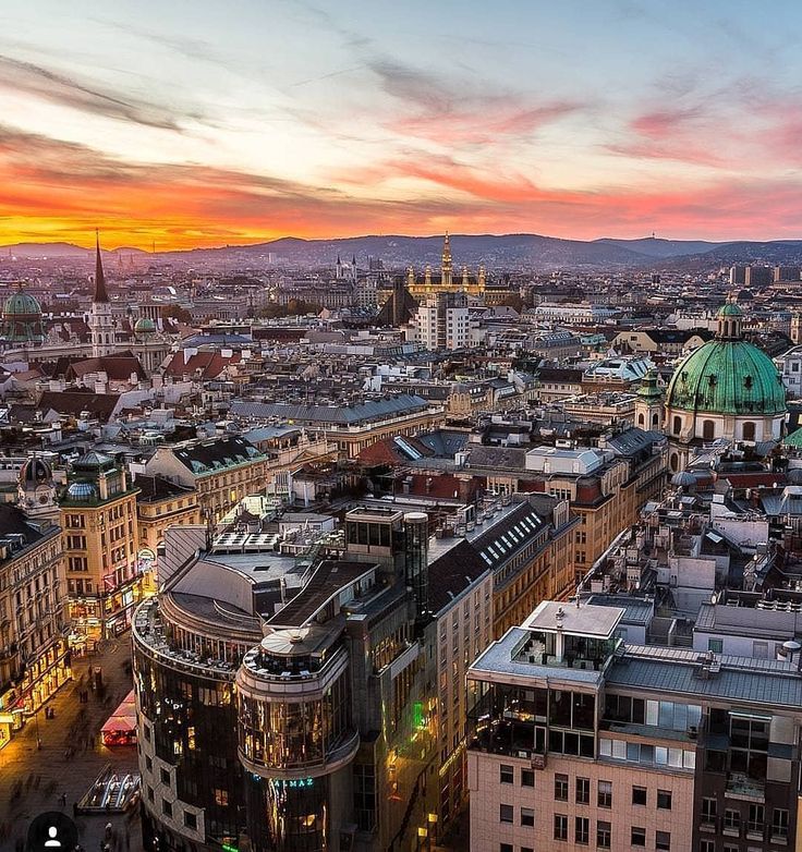 an aerial view of the city at sunset