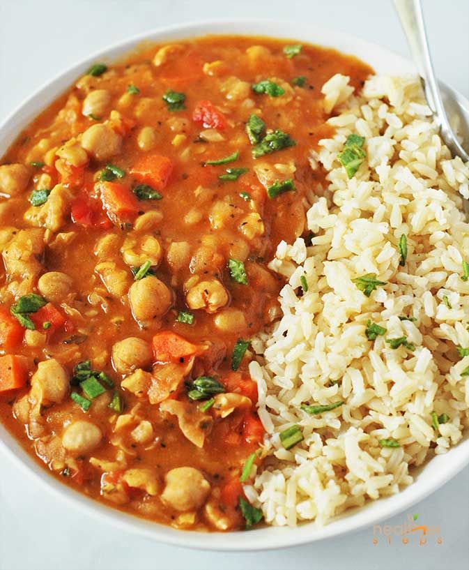 a white bowl filled with rice and beans