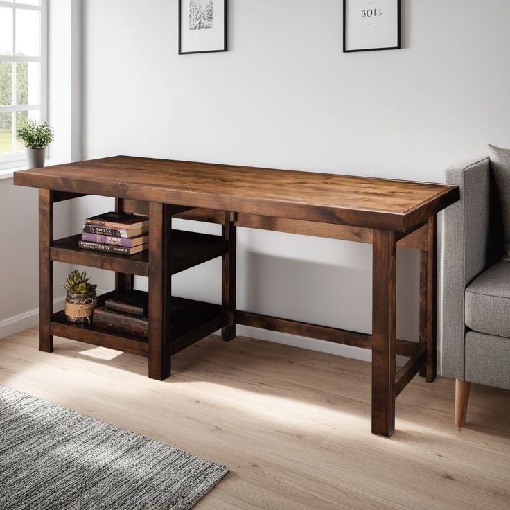 a wooden table sitting on top of a hard wood floor next to a gray couch