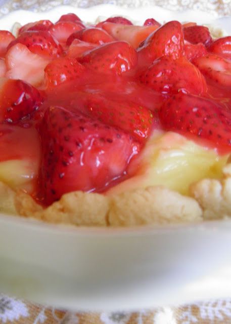 a dessert dish with strawberries and bananas on top