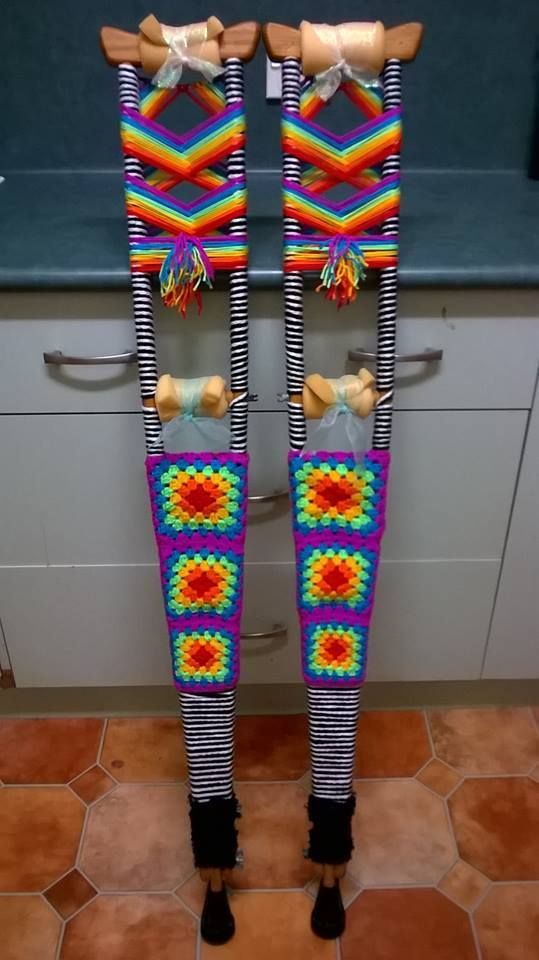 two wooden skis are decorated with multicolored designs