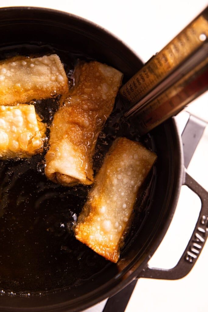 some food is cooking in a pot on the stove