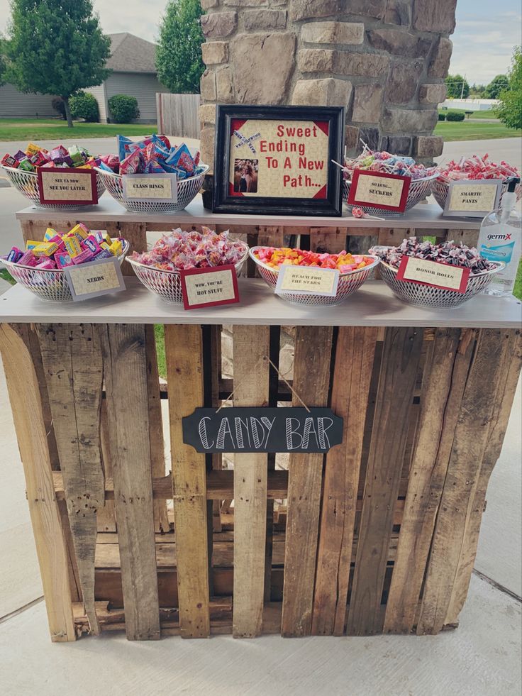 a candy bar is set up outside on the side of the road for people to eat