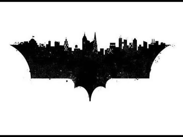 the dark knight rises logo in black and white, with an image of batman's silhouette