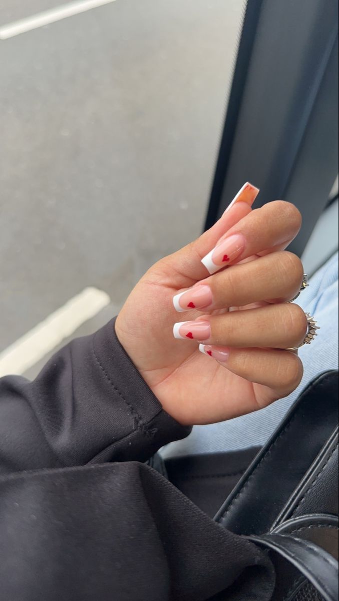 Valentine Nails Designs Square, Nail Inspo Valentines Day Square, Valentines Nails White French Tip, Nail Inspo Red Heart, Pink French With Red Heart, French Red Heart Nails, White French Nails With Red Heart, Heart French Tip Nails Square, White Red French Nails